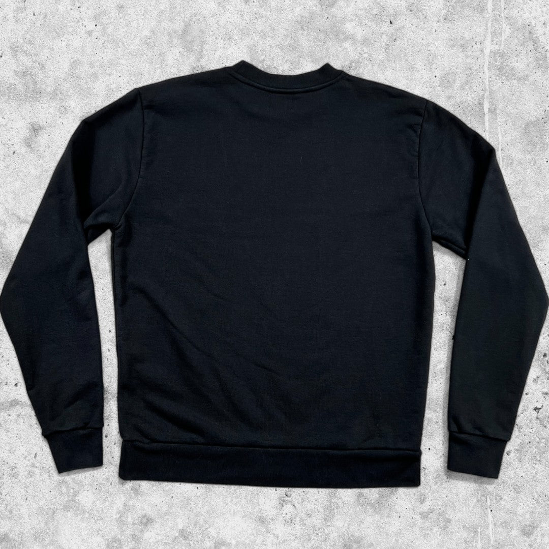 Minimalist black Arte Antwerp sweatshirt with embroidered logo seen from the back