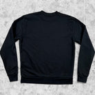 Minimalist black Arte Antwerp sweatshirt with embroidered logo seen from the back