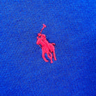 Detail of embroidered logo in red on Ralph Lauren sweatshirt