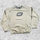 Pull Nike Vintage Homme 2000's beige  avec le logo de la marque brodé vue de face